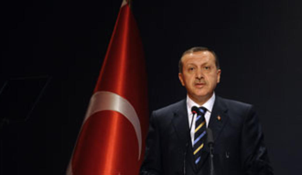 Turkey's President Erdoğan in front of nation's flag