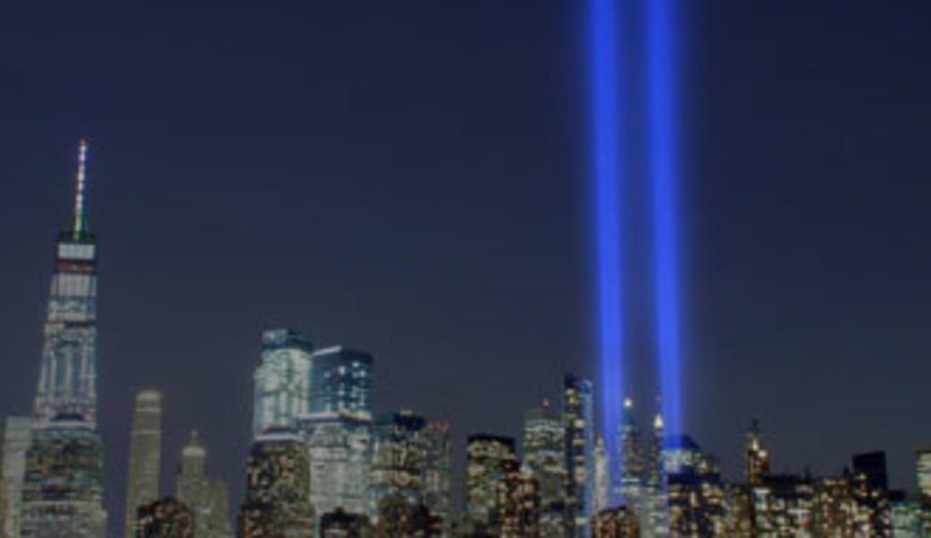 lights commemorating September 11 agains New York City skyline