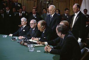 Signing the peace agreement to end the Vietnam War