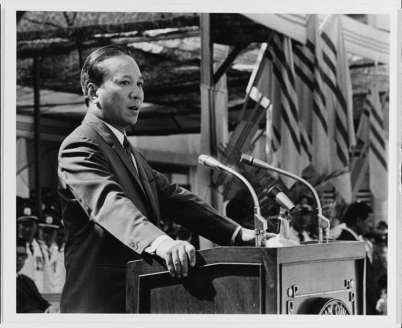 Nguyen Van Thieu stands in front of a podium
