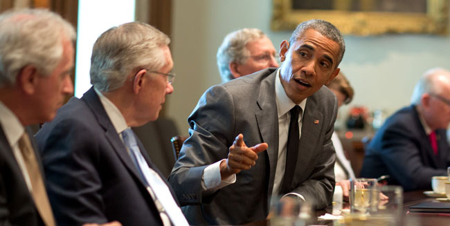 Barack Obama pointing in a meeting