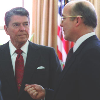 Ronald Reagan talking with John Poindexter