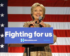Hillary Clinton with campaign sign