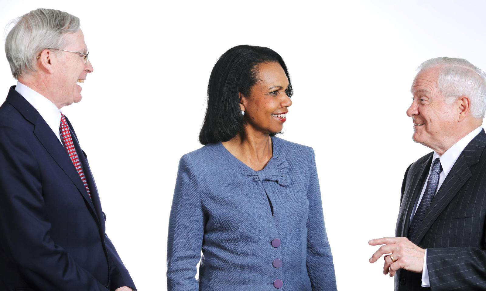 Stephen Hadley, Condoleeza Rice, and Robert Gates talking to each other