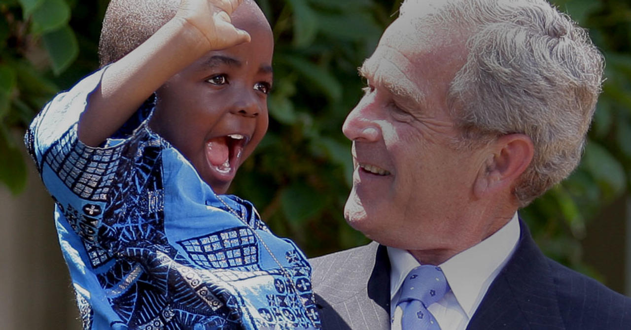 Bush holding a child