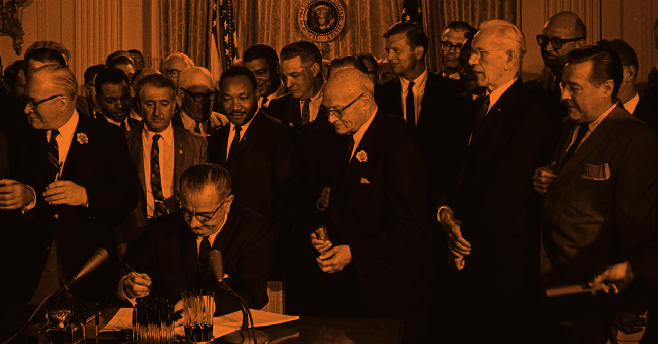 LBJ signs Civil Rights Act