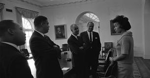 Martin Luther King Jr., Whitney Young, Roy Wilkins, James Farmer, and Geraldine Whittington talk together at White House