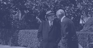 President Lyndon Johnson talks with Senator Richard Russell outside the White House
