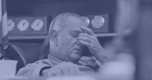President Lyndon Johnson holding his face
