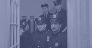 Police officers standing in doorway