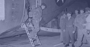 Belgian troops stepping off a plane in 1964