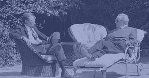 Robert McNamara and President Lyndon Johnson talking and sitting outside