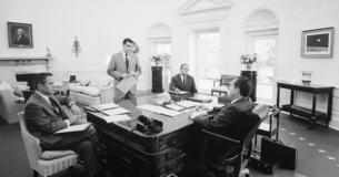 President Nixon meeting with aides in Oval Office