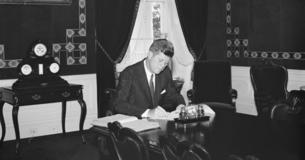 President Kennedy at desk