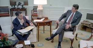 President Ronald Reagan meets with Secretary of Defense Caspar Weinberger in the Oval Office.