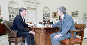 President Ronald Reagan meeting with Martin Anderson in the Oval Office.