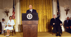 President Gerald Ford delivers remarks at a lectern after taking the oath of office.