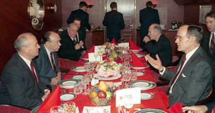 President George H. W. Bush sitting across from President of the Soviet Union Mikhail Gorbachev at the Malta Summit in 1989