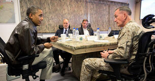President Obama receives a briefing from General Joseph Dunford