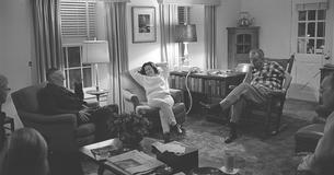 Group sitting around the LBJ Ranch living room 