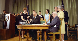 LBJ signing Medicare and Medicaid Act