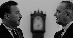 Adam Clayton Powell and LBJ look at each other