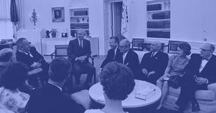 President Lyndon B. Johnson speaks with various judges and their wives