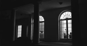 View of LBJ through window at night