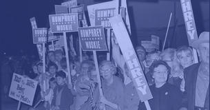 people in a crowd holding Humphrey/Muskie signs during the 1968 presidential campaign