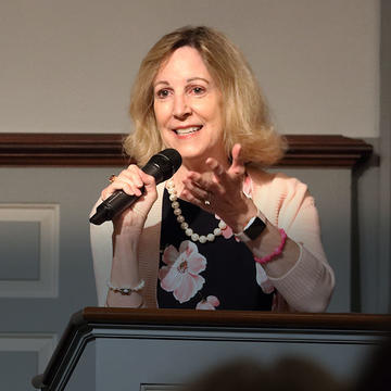 Barbara Perry speaking at the podium