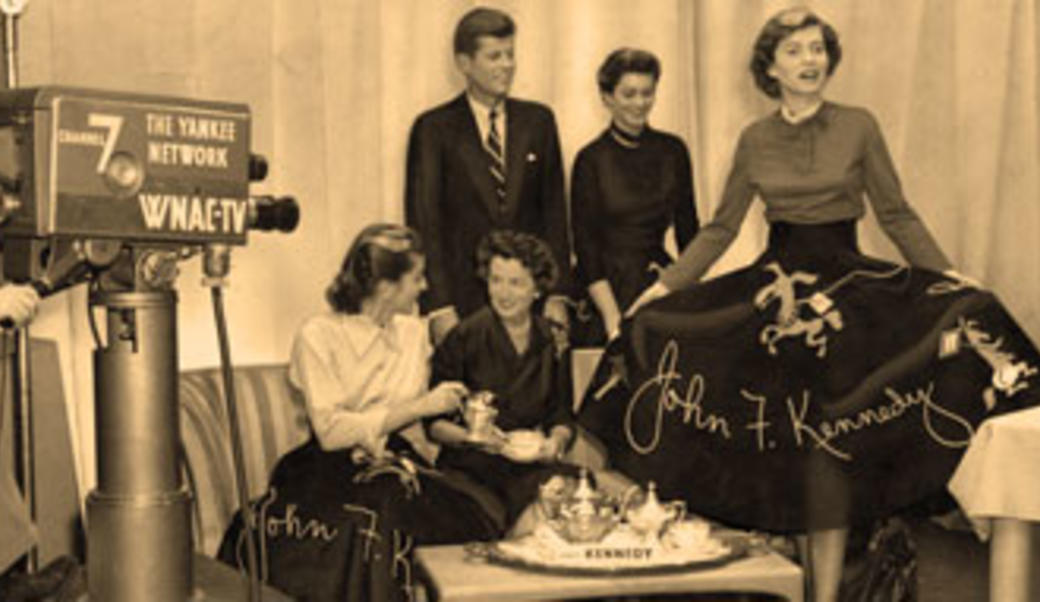 Kennedy Family drinking tea for a TV camera