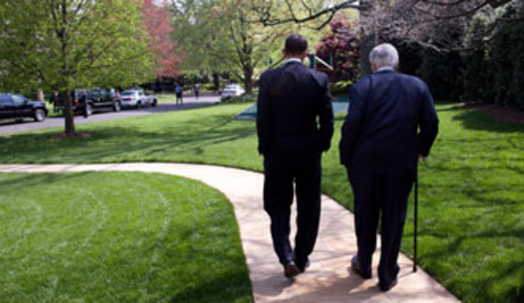 Kennedy walking with President Obama in 2009