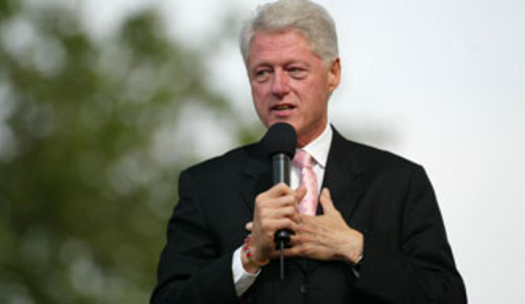President Bill Clinton speaking on a microphone