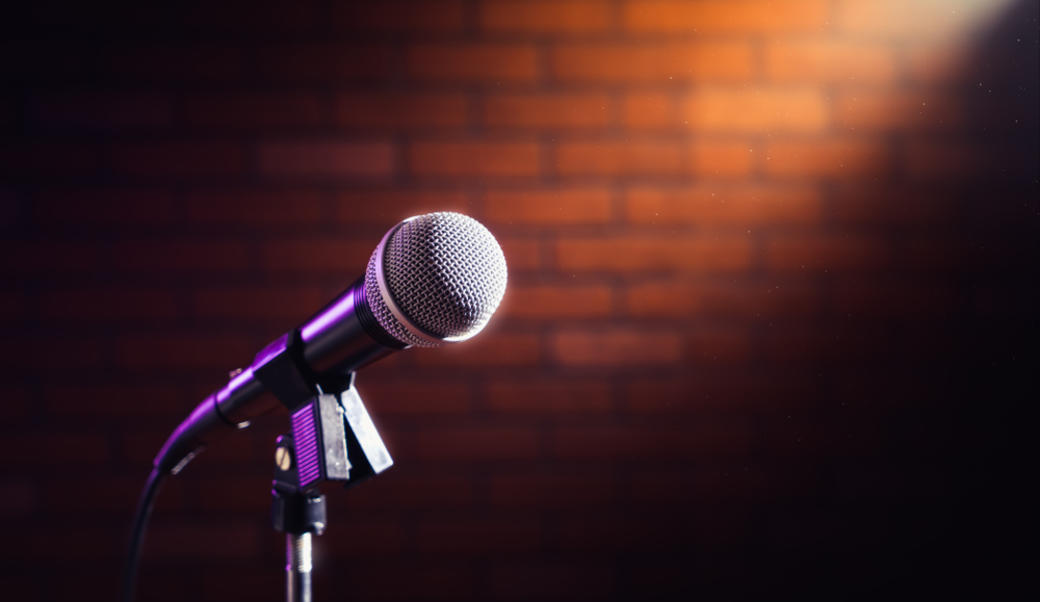 a mic against a red brick wall