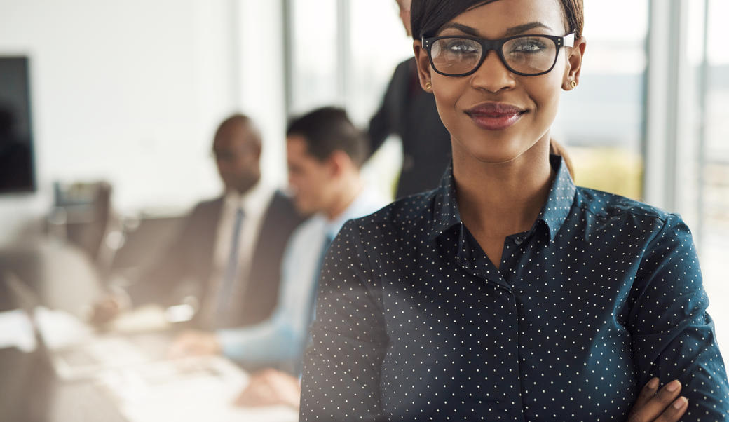 woman standing in office meeting