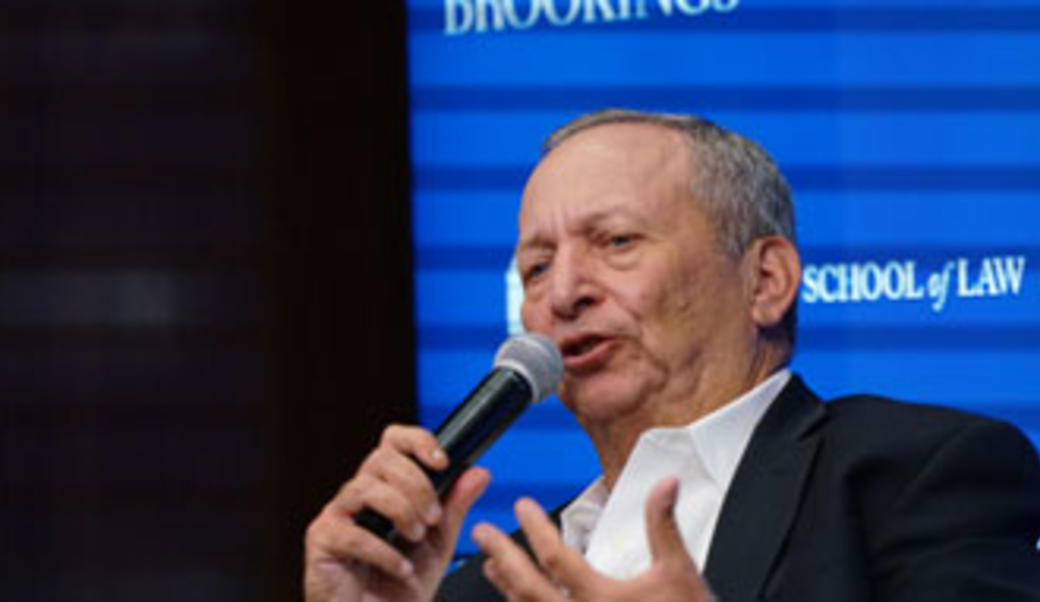 Larry Summers speaking into a microphone