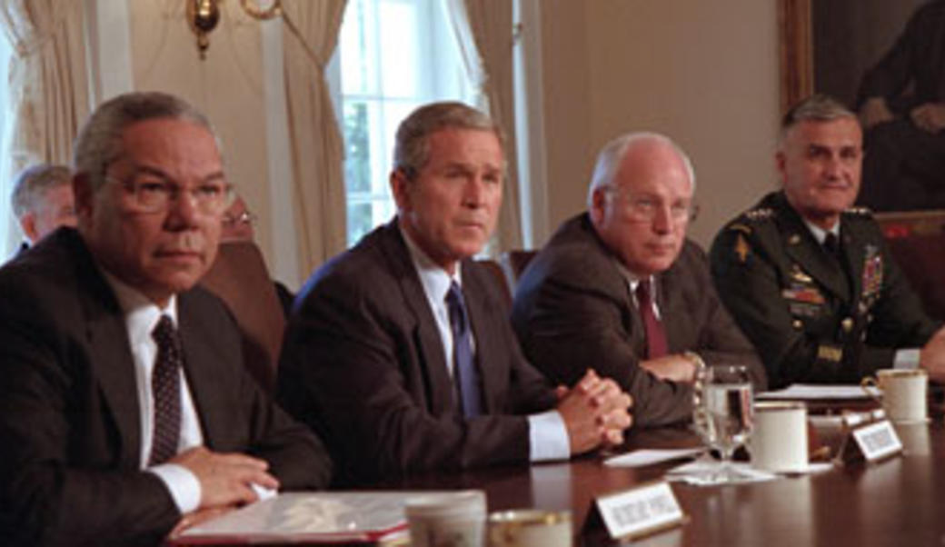 President Bush at table with advisors