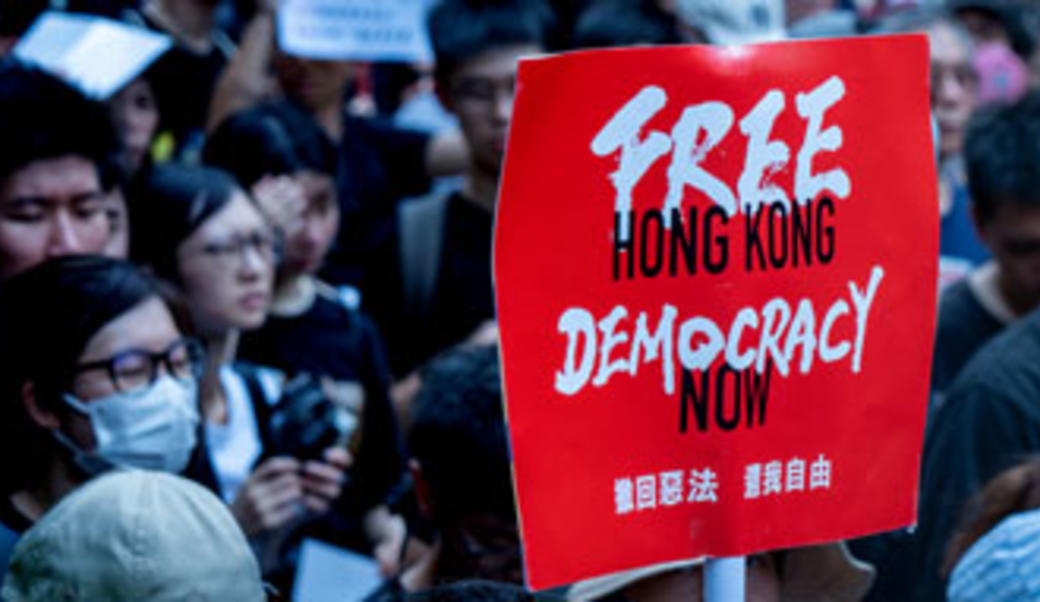 Sign during protest; says "Free Hong Kong: Democracy now"