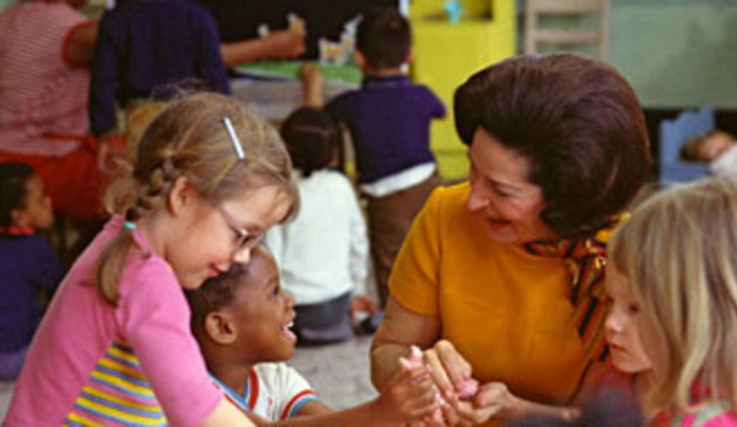 Lady Bird Johnson reading to children in school