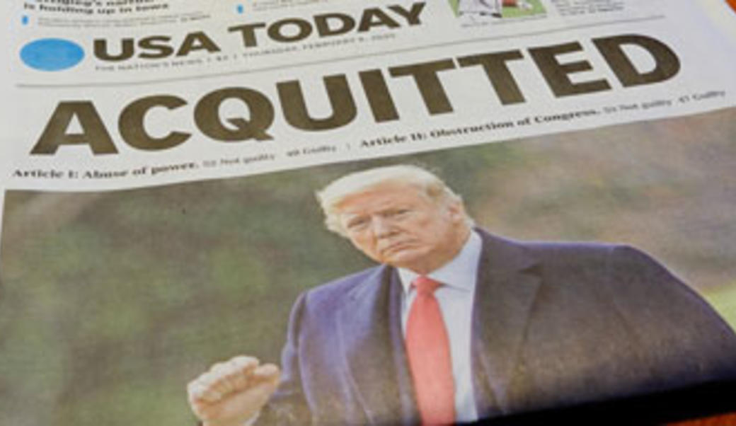 newspaper headline "acquitted" with picture of Donald Trump