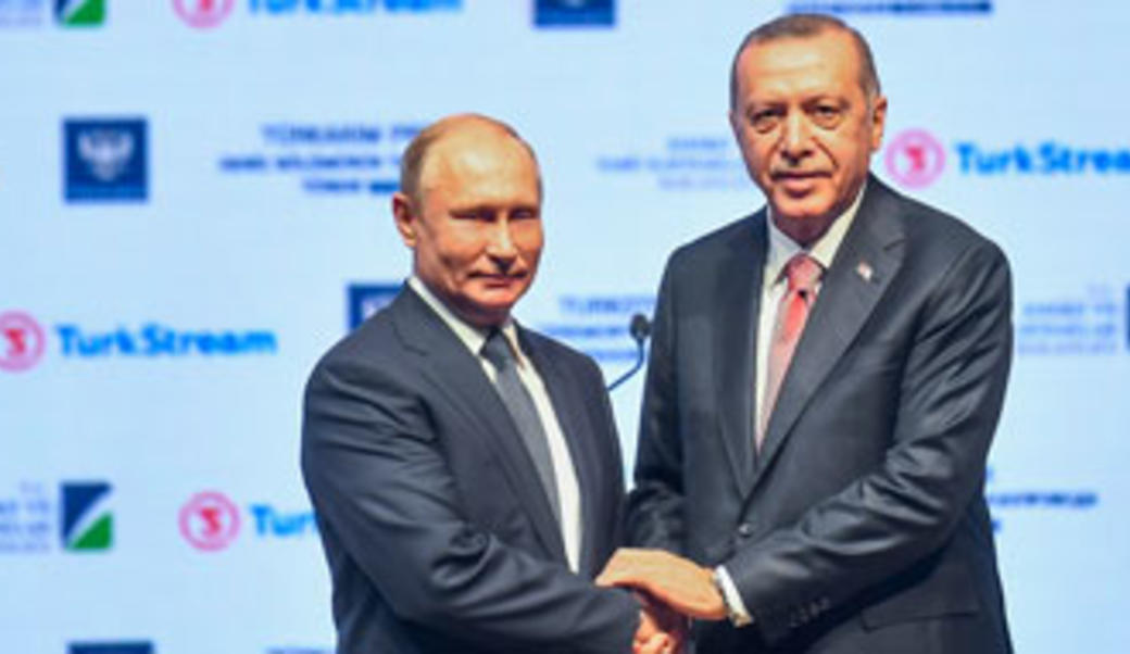 Vladimir Putin and Tayyip Erdogan shaking hands