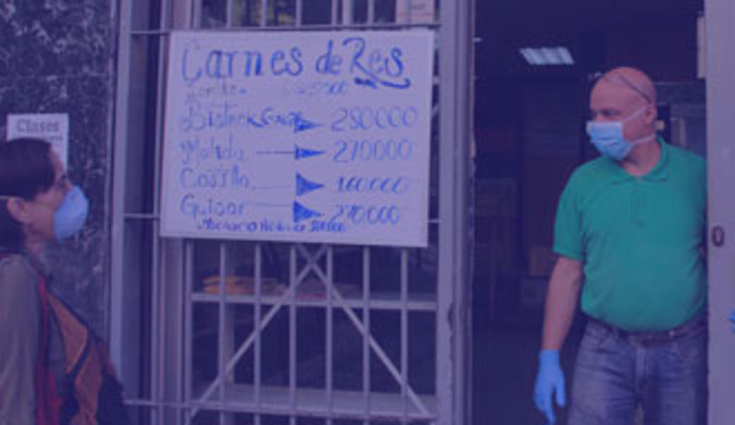 Venezuela shopkeeper during the coronavirus pandemic, wearing a face mask and gloves