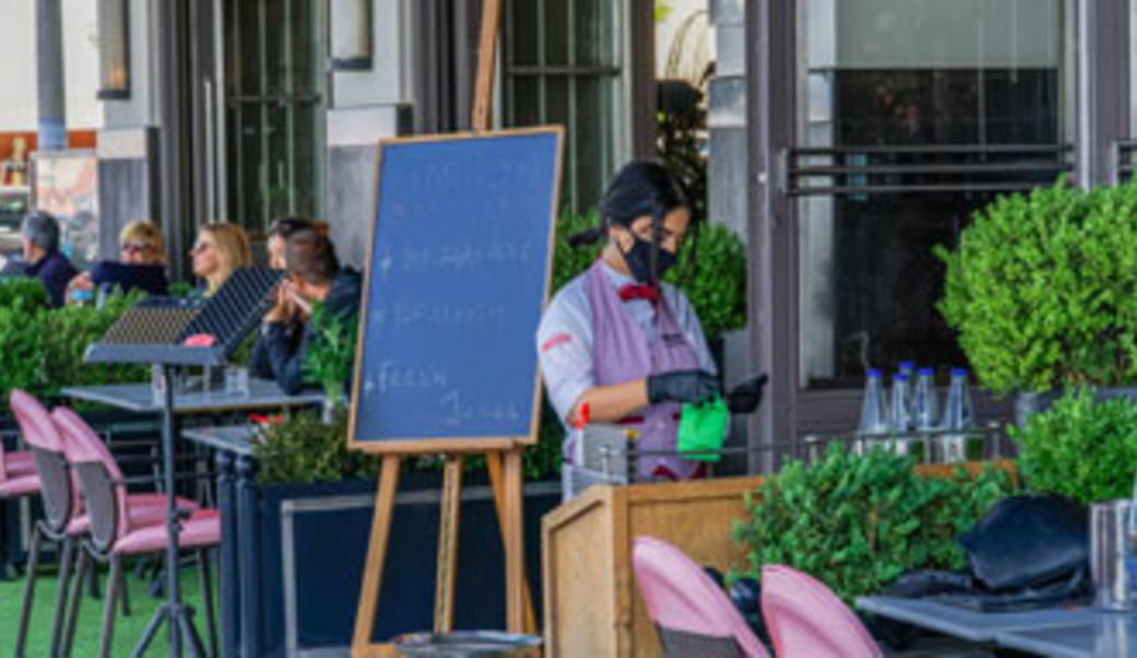 Thessaloniki, Greece - May 25 2020: Bars open for the first day for the summer. Crowd sitting on bar restaurants at the city center, after Hellenic government loosens COVID-19 coronavirus measures.