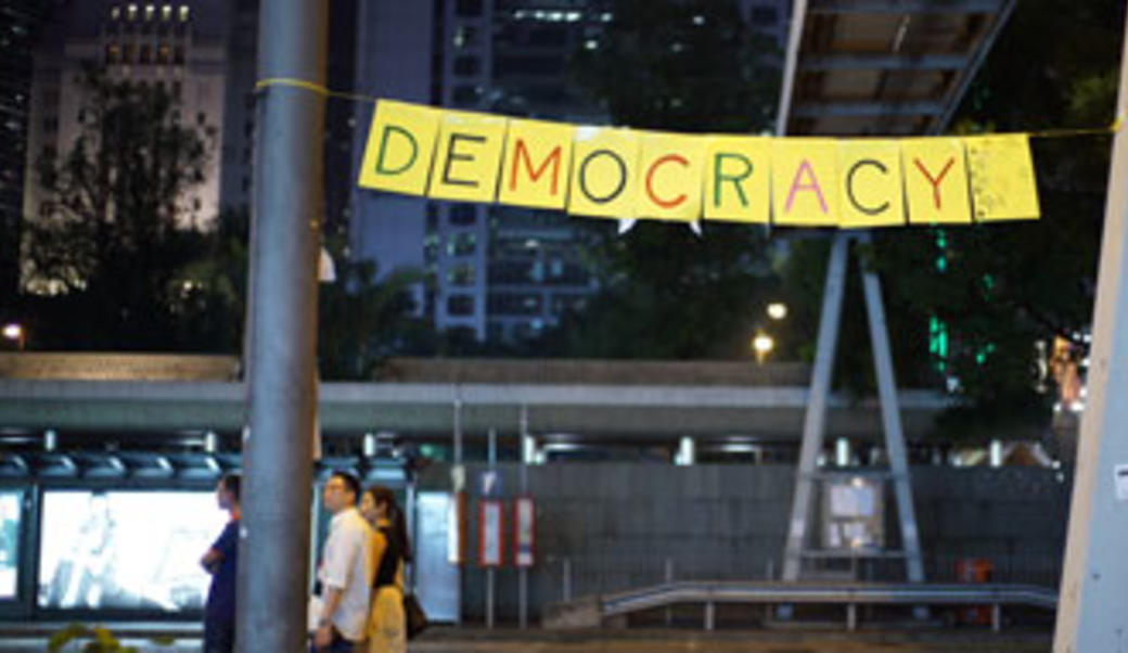sign spelling out "democracy"