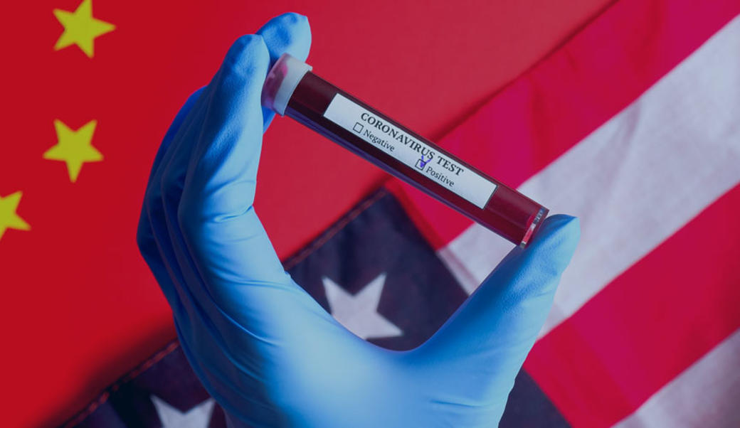 Chinese-US flags with test tube in gloved hand