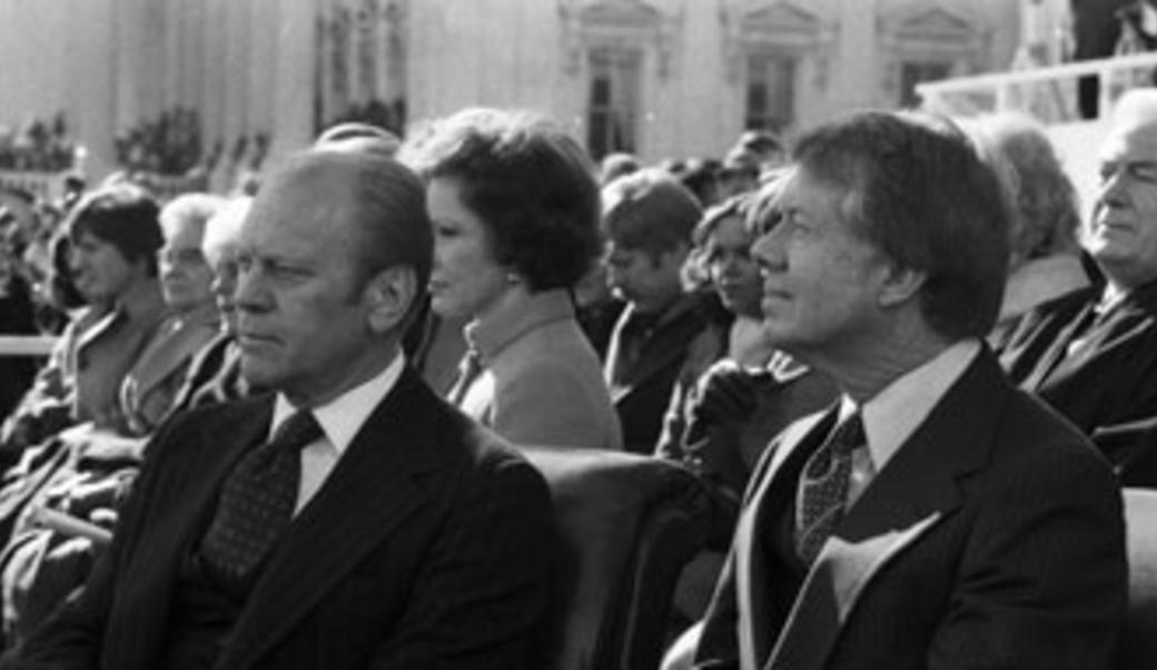 Gerald Ford and Jimmy Carter sitting next to each other