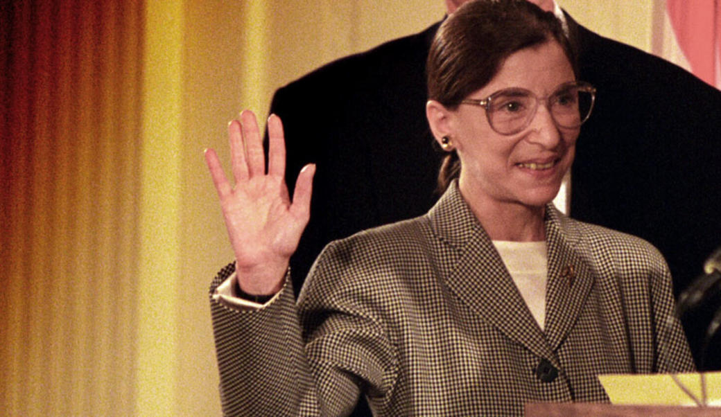 Ruth Bader Ginsburg with right hand raised