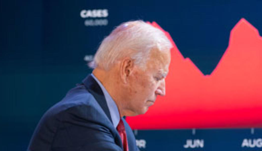 Joe Biden in front of Covid cases graph