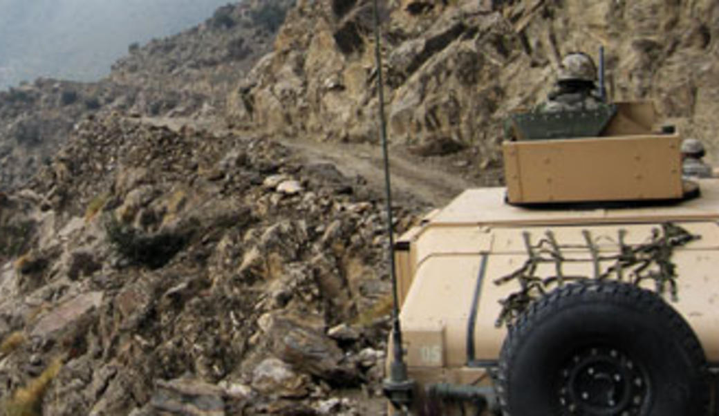 Army vehicle in mountainous Afghan terrain