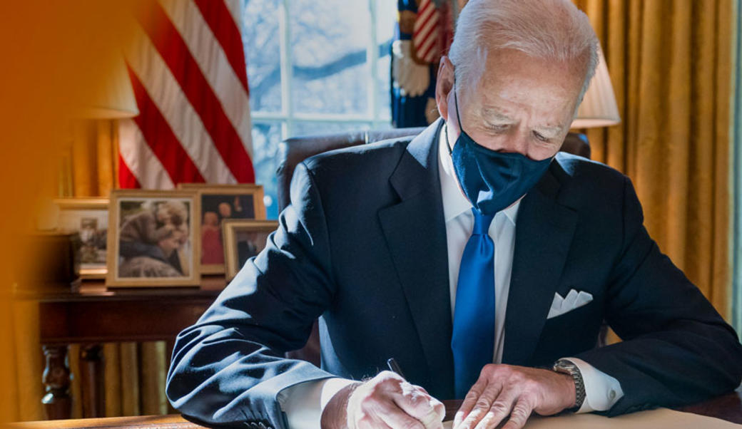 Joe Biden signing a bill